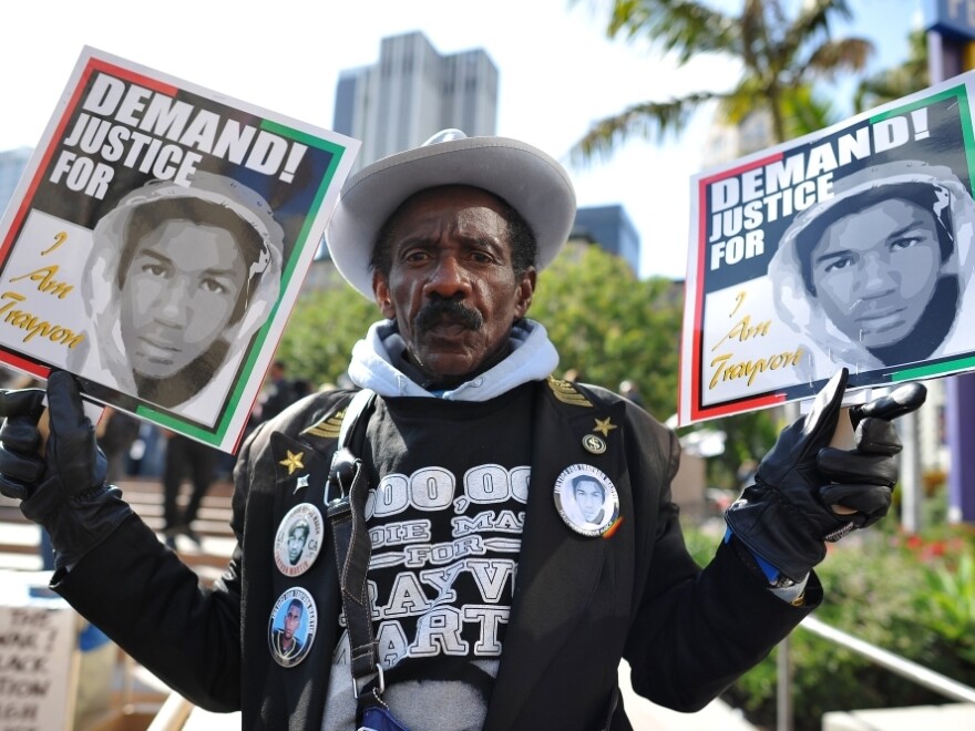 A man joins nationwide protests in memory of slain Florida teenager Trayvon Martin, in downtown Los Angeles on Monday. 