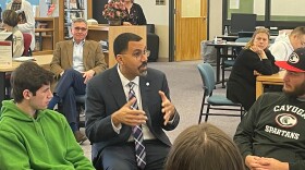  SUNY Chancellor John King speaks with students at Cayuga Community College's Auburn Campus on March 20. 