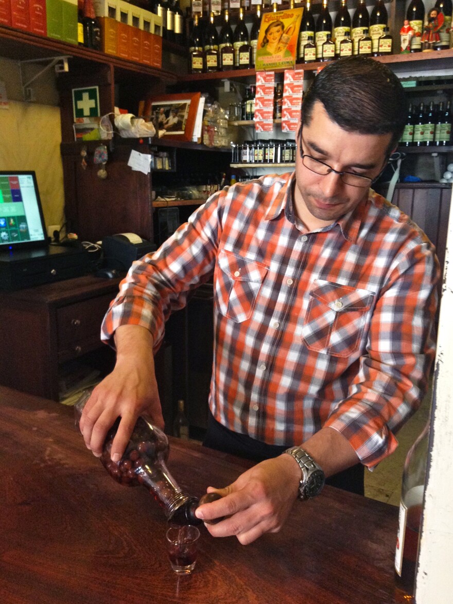 Nuno Goncalves pours out 50-cent glasses of Portuguese <em>ginja</em> — sweet cherry liqueur — in his tiny historic shop in downtown Lisbon. Goncalves recently installed a cash register, but it doesn't print individual receipts. He says no one has ever asked him for one.