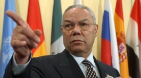 U.S. Secretary of State Colin Powell points to a reporter during a news conference outside of the United Nations Security Council Chambers, Friday, March 7, 2003.