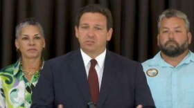 Gov. Ron DeSantis at a press conference in Cape Coral July 8, flanked by Agency for Health Care Administration Secretary Simone Marstiller and Florida State Rep. Adam Botana (R-Bonita Springs) (photo: The Florida Channel)
