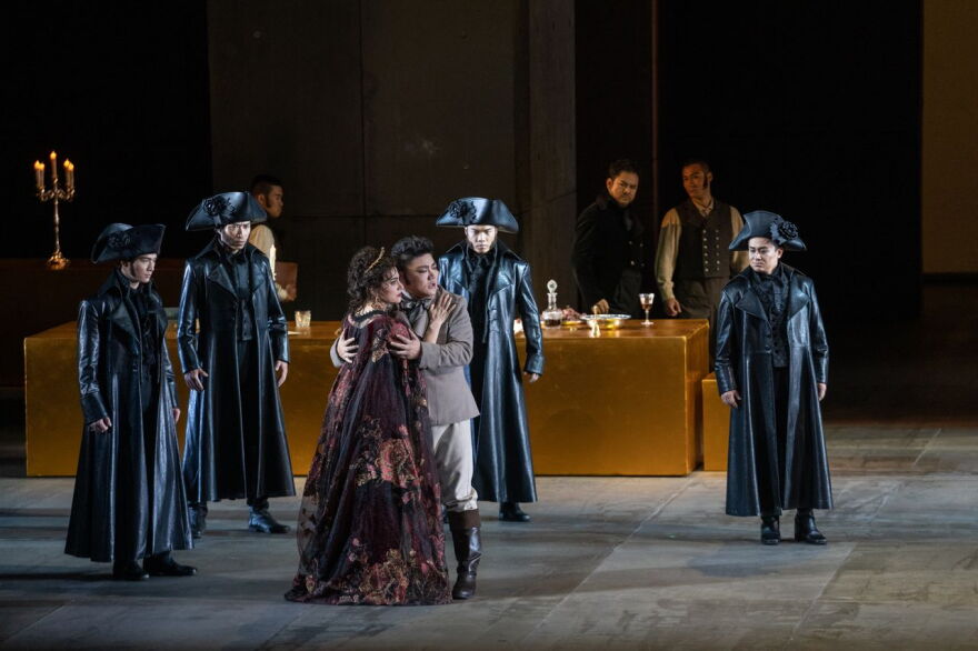 A scene from the NCPA's production of Puccini's Tosca. Embracing are soprano Monica Zanettin (Tosca) and tenor Han Peng (Cavaradossi).