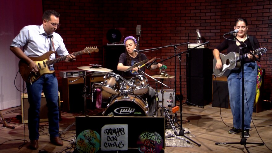 Papayas Con Chile guitarist Isreal Chávez (left), drummer Celina Corral (center), and rhythm guitarist Kayla Martinez (right).