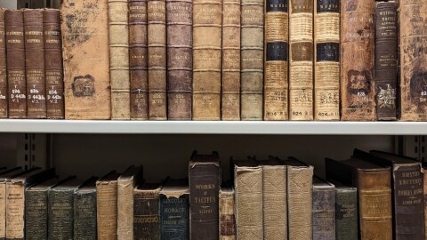 Old books on shelves.