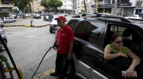 Venezuelans filling their tank at a Caracas gasoline station last year. 