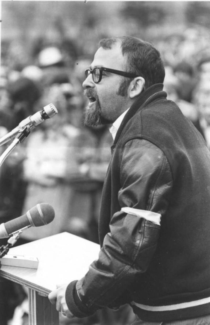 A photo of Jerry M. Lewis, wearing the white armband of a faculty marshal, that appeared in the 1971 Chestnut Burr.