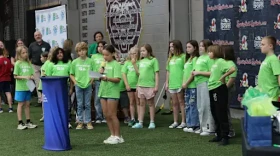 Elementary students in the Springfield Public Schools District present checks to local charities in April 2026.