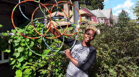Shani Blueford holds up interlaced hula hoops