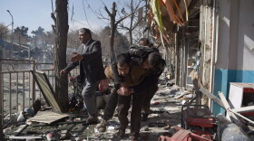 Afghan volunteers carry a body at the scene of a car bomb exploded in front of the old Ministry of Interior building in Kabul on Jan. 27, 2018.
An ambulance packed with explosives blew up in a crowded area of Kabul on January 27, killing at least 17 people and wounding 110 others, officials said, in an attack claimed by the Taliban. (Wakil Kohsar/AFP/Getty Images)