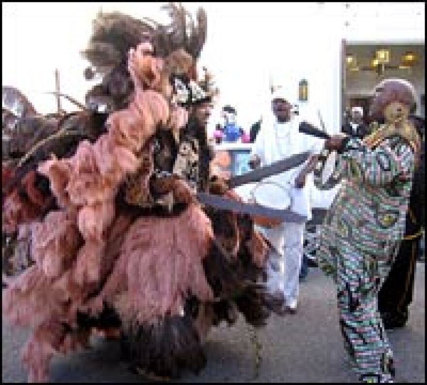 Harrison, all swords and plumage, faces off with the lead in his signal drum corps.