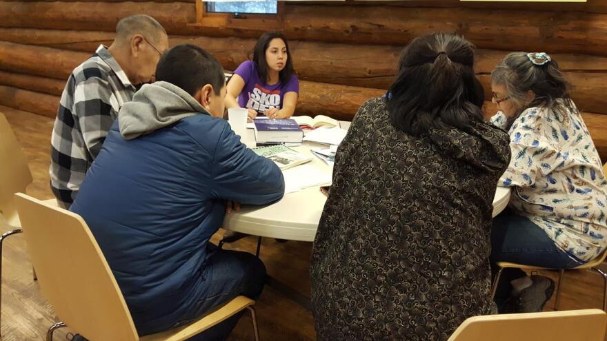Annauk Olin, center, works with a group of Inupiaq speakers Thursday, December 12, 2019, on translating census and other materials at the Alaska Native Heritage Center, Anchorage. (Tripp J Crouse/KNBA)