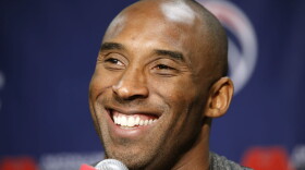 Kobe Bryant smiles during a media availability before a basketball game in 2013. (Alex Brandon/AP)