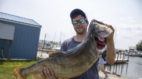 Alpena resident Marshal Suszek holds up his 25.2-pound lake trout during the Michigan Brown Trout Festival’s High Stakes Tournament on Sunday, July 20, 2025. It was the second biggest fish of the weekend.