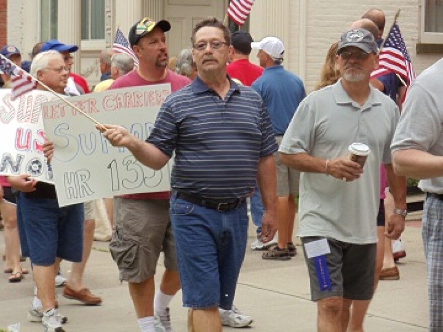 Branch 3 letter carriers join the NYS contingency by demonstrating in front of Congressman Chris Gibson's office. He is one of only five NYS Congressman who have yet to sign onto HR1351.
