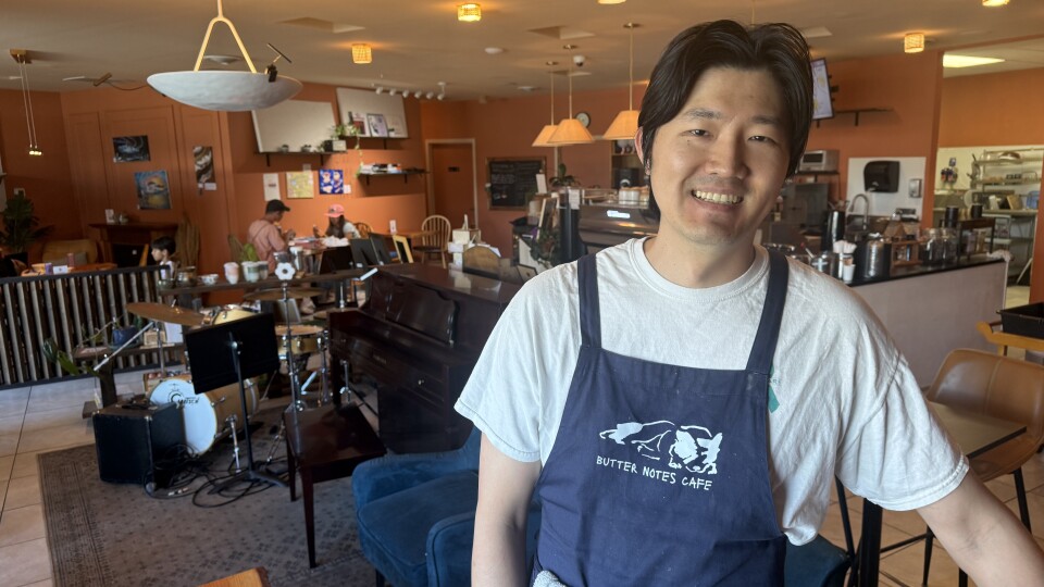 Owner Sean Dokko poses inside Butter Notes Cafe.