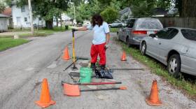 Michael Warren has spent about $400 out-of-pocket this summer to fill potholes in his Indianapolis neighborhood.