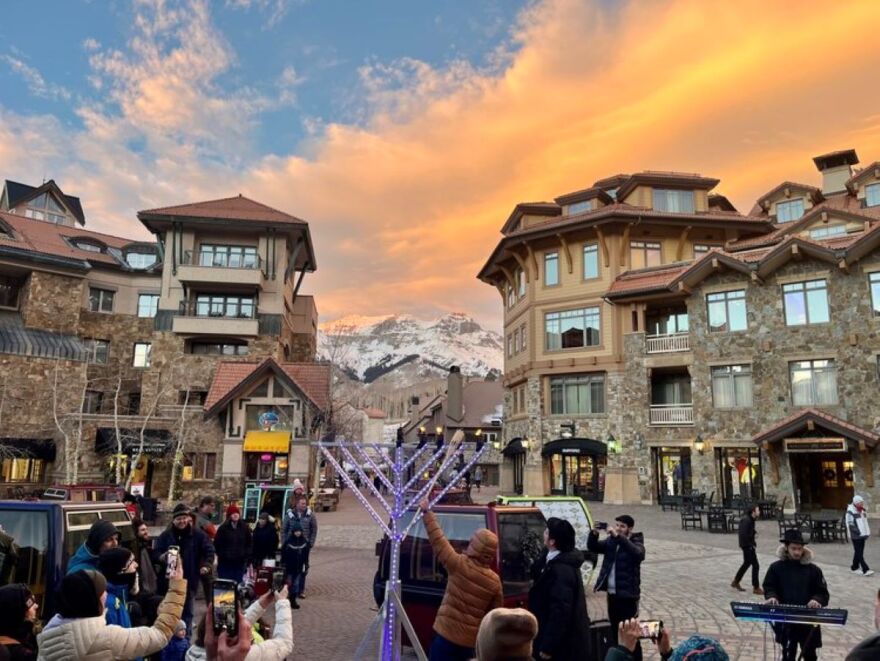 Reuven Tanny lights the menorah in Mountain Village above Telluride, CO