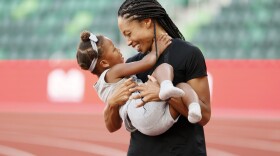 Allyson Felix celebrates with her daughter Camryn after day nine of the 2020 U.S. Olympic Track & Field Team Trials at Hayward Field on June 26, 2021 in Eugene, Oregon. (Steph Chambers/Getty Images)