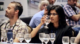  Susheera Pochiraju sips tap water from a selection of samples at the American Water Works Association Rocky Mountain meeting. A panel of judges compared water from six different Colorado cities to pick the best-tasting.