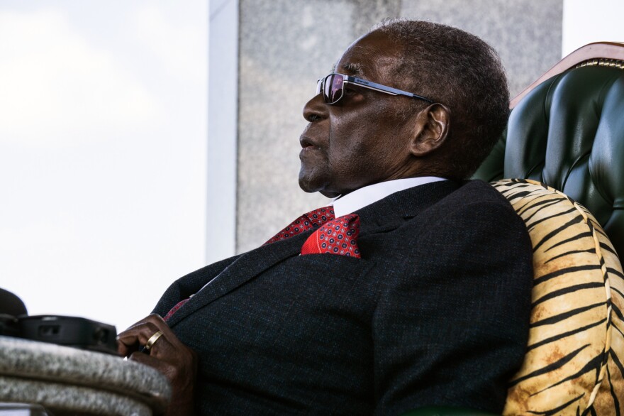 On the eve of Zimbabwe's first election without him on the ballot, former President Robert Mugabe addresses the press at his home.