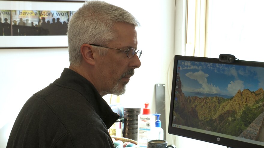 Forrest Gilmore working at his desk.