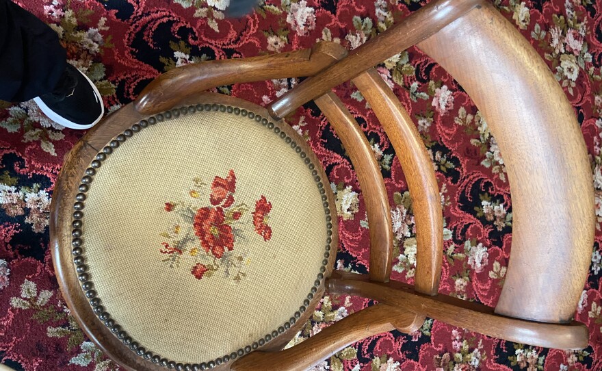One of the dining chairs embroidered by Mrs. Lindsay