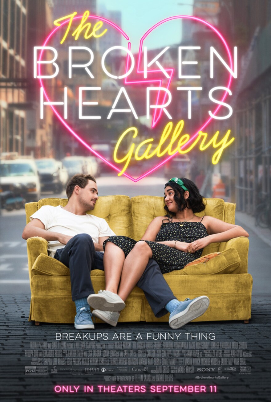 Movie poster for the Broken Hearts Gallery. Two people sitting on a couch and looking at each other.