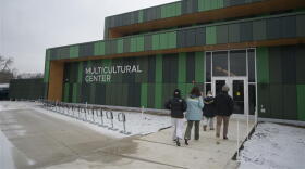students entering MSU's Multicultural center on a snowy day