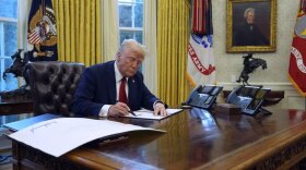 President Donald Trump signs executive orders in the Oval Office at the White House, Thursday, Jan. 30, 2025, in Washington. (AP Photo/Evan Vucci)
