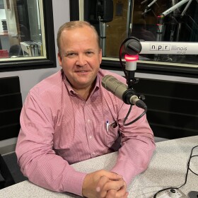 Ryan McCrady in NPR Illinois Studios at microphone.