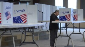 A voter fills out their ballot on Election Day at a Monroe County polling location.