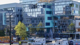 Emergency crews work at the scene of a construction crane collapse where four people were killed and four others injured Saturday, April 27, 2019, in the South Lake Union neighborhood of Seattle.
