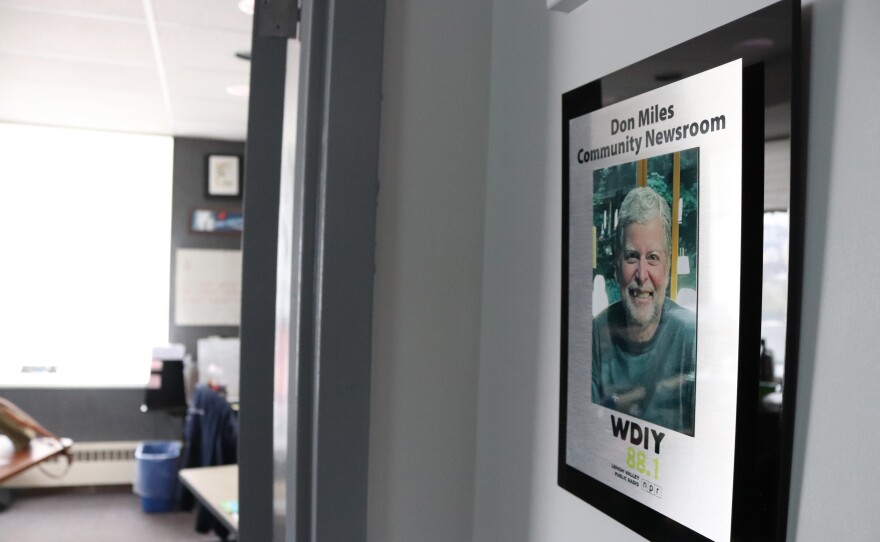 A new plaque naming WDIY's newsroom in Don Miles' honor has been installed at the radio station.