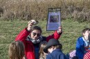 Natalie Brown, teacher at Bluestem Hall Nature School in Urbana, Illinois is pictured with children near prairie plantings during an outdoor class on October 30, 2025.