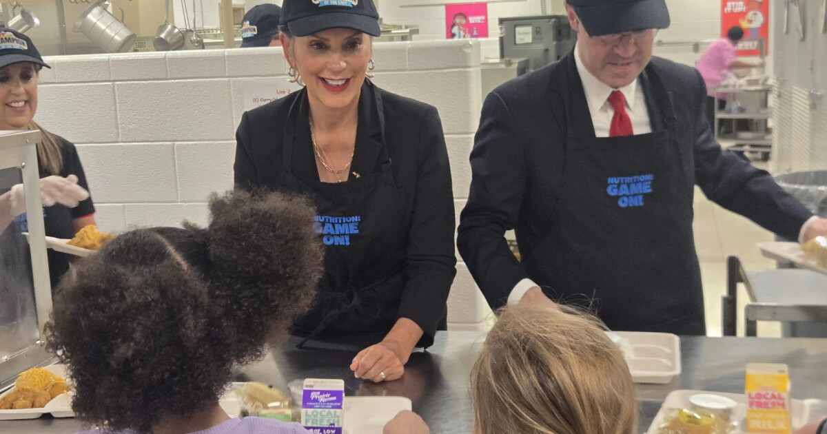 Whitmer passes out school lunches, takes policy questions