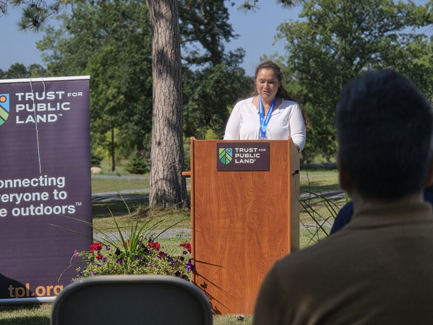 Endazhi-Nitaawiging Executive Director Victoria Wind addresses the audience during a ribbon-cutting ceremony on Aug. 25, 2026.