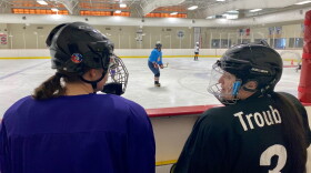 Megan Cairns looks on and chats with a teammate as KCWHL members scrimmage.
