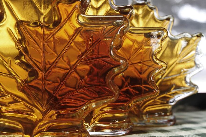 Bottles of maple syrup in leaf-shaped bottles