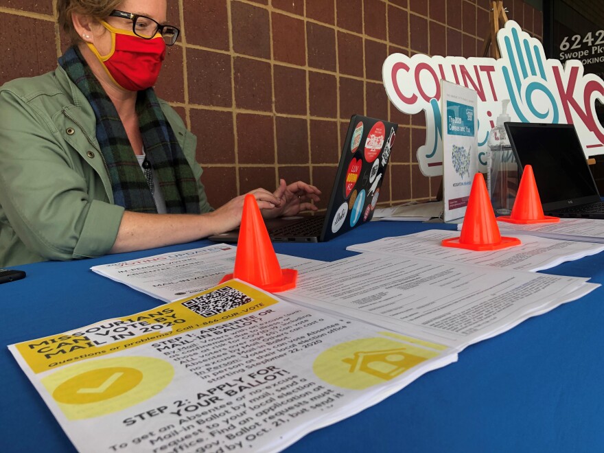 Jenny Garmon sits outside the southeast branch of the Kansas City Public Library, ready to assist residents who need to fill out the 2020 Census.