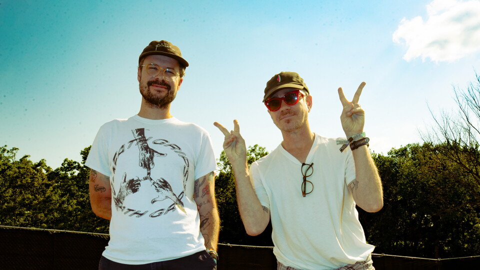 two men posing for a photograph 