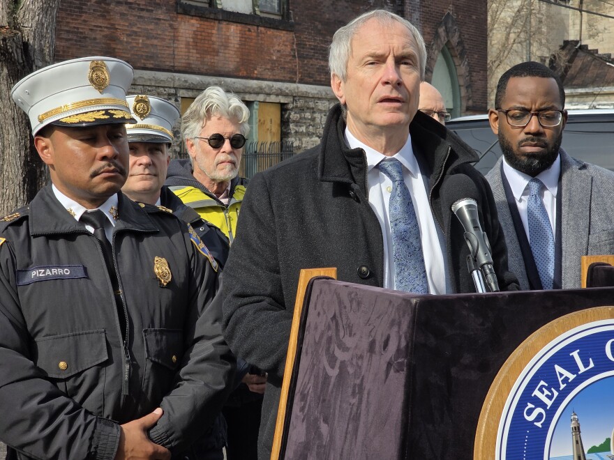 Buffalo Mayor Sean Ryan, joined by Fire Commissioner Daniel Pizarro (left) and Deputy Mayor Thomas Baines (right) in front of 486 Emslie St.