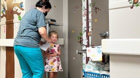 Khloe Tinker is measured ahead of an appointment at the Doniphan Family Clinic in Doniphan, Missouri. The clinic is the only source for specialized pediatric care in its rural Ozark county.