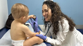 Dr. Gabriela Garrote treating a patient at Gables Pediatrics.
