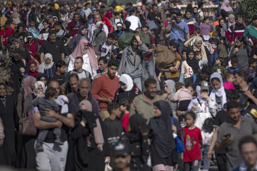 Palestinians flee to the southern Gaza Strip on Salah al-Din Street in Bureij, Gaza Strip, Nov. 10.