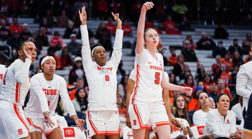 Georgia Woolley watches her shot on its way to the basket with her team behind her in SU's WNIT win over Kent State.