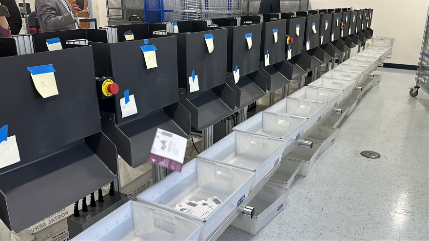 A sorting machine separates sample ballots into bins during a demonstration of voting equipment at the Montgomery County Board of Elections headquarters in Gaithersburg, Md., Thursday, Jan. 22, 2026. (AP Photo/Robert Yoon)