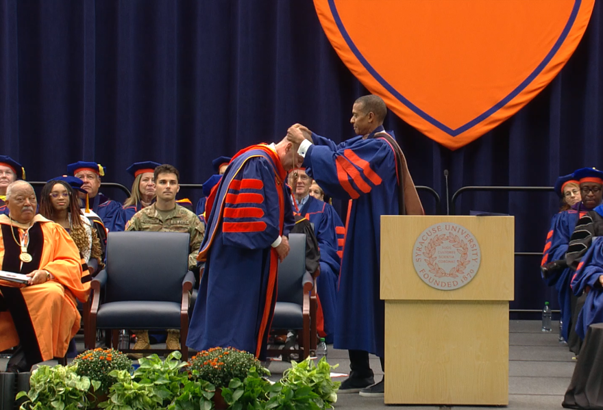 Chairman of the SU Board of Trustees Jeff Scruggs bestows the chancellor's medallion upon Chancellor Michael Haynie.