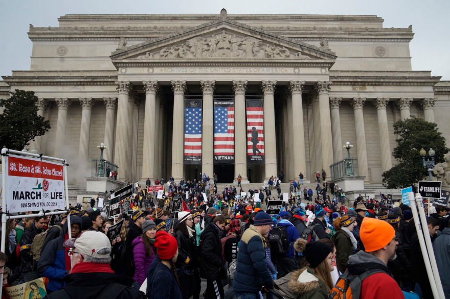 People march through Washington, D.C., to the U.S. Supreme Court – a location that symbolizes the long-held goal of reversing the <em>Roe v. Wade</em> decision that legalized abortion nationwide in 1973.