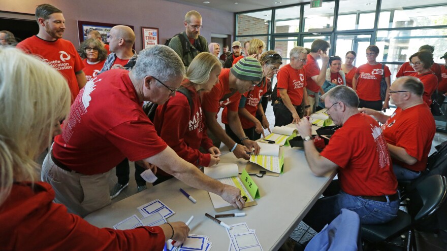 Members of the Seattle Education Association, seen here as their strike was suspended last week, have voted to accept a new contract.