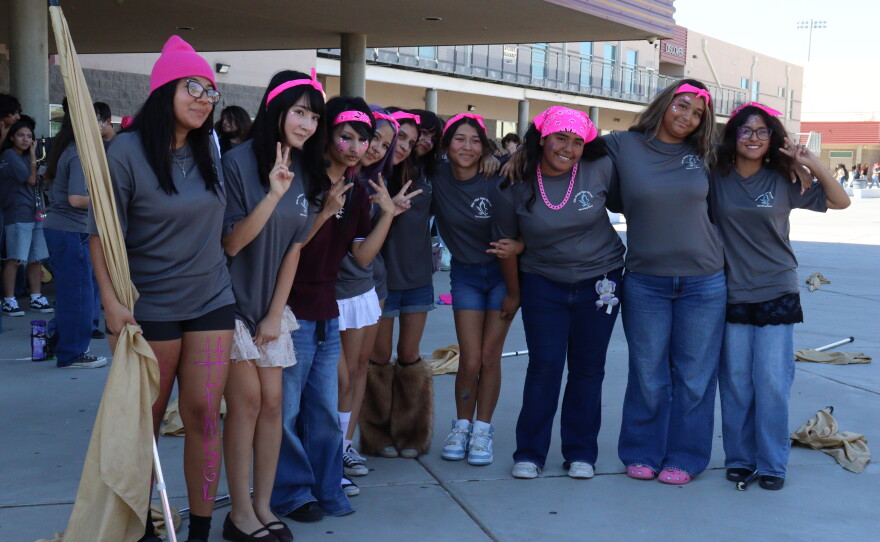 Students pose for a group photo after their flag performance.